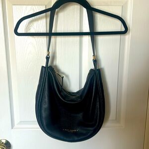 Marc Jacob’s black and gold leather hobo bag